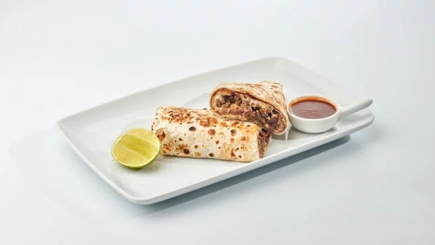 beef burrito with salsa and sour cream