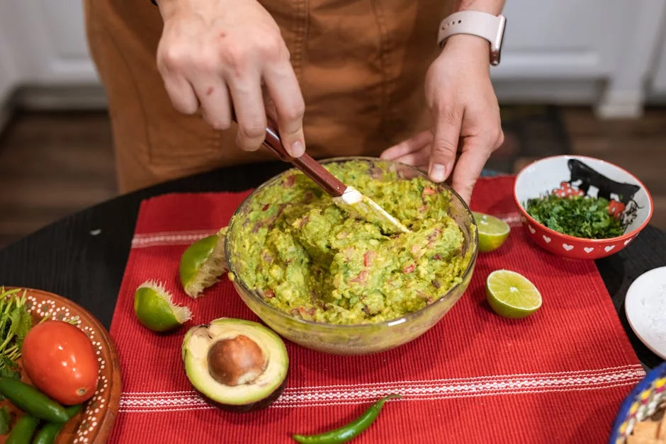 fresh guacamole preparation with ripe avocados